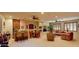 Expansive living space with a built-in bar, dining area, and cozy seating offers versatile options for relaxation and entertaining at 12797 S 179Th Dr, Goodyear, AZ 85338