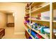 Well-organized pantry with multiple shelves, offering ample storage solutions at 12797 S 179Th Dr, Goodyear, AZ 85338