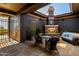 Inviting patio space featuring an outdoor fireplace and comfortable seating, great for relaxing and enjoying the outdoors at 12797 S 179Th Dr, Goodyear, AZ 85338