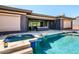 Outdoor patio features seamless indoor-outdoor living with a pool and spa, perfect for relaxation at 12797 S 179Th Dr, Goodyear, AZ 85338