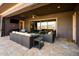 Stylish covered patio with cozy seating and picturesque mountain vistas at 12797 S 179Th Dr, Goodyear, AZ 85338
