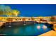 Luxurious pool with waterfall features and lush landscaping, perfect for relaxation at 12797 S 179Th Dr, Goodyear, AZ 85338
