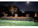 Beautiful pool featuring lit water features and a tranquil moonlit ambiance at 12797 S 179Th Dr, Goodyear, AZ 85338