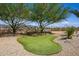 Backyard putting green provides a fun, private space for golf enthusiasts with desert views at 12797 S 179Th Dr, Goodyear, AZ 85338