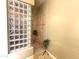 Modern shower stall with glass block and tiled walls at 12797 S 179Th Dr, Goodyear, AZ 85338
