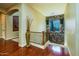 Foyer with hardwood floors, staircase, and accent wall with stone detail and a window at 12797 S 179Th Dr, Goodyear, AZ 85338