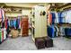 Large walk-in closet with plenty of shelving, drawers, and a center storage island at 12797 S 179Th Dr, Goodyear, AZ 85338