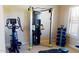Featuring an exercise bike and weight machine, this workout room supports a healthy lifestyle at home at 12797 S 179Th Dr, Goodyear, AZ 85338