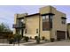 Tan two-story house with a brown garage door and small landscaping at 31510 N 24Th Dr, Phoenix, AZ 85085