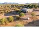 Aerial view of property with barn, round pen, and training equipment at 14021 E Milton Ct, Scottsdale, AZ 85262