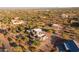 Aerial view of a luxury home with a pool and large lot in a desert setting at 14021 E Milton Ct, Scottsdale, AZ 85262