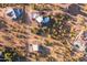 An aerial view of a property with a large house and putting green at 14021 E Milton Ct, Scottsdale, AZ 85262