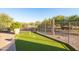 Landscaped backyard with artificial turf and fence at 14021 E Milton Ct, Scottsdale, AZ 85262