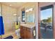 Bathroom with glass shower, tiled flooring, and modern vanity at 14021 E Milton Ct, Scottsdale, AZ 85262