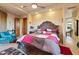 Main bedroom with a large bed, sitting area and ensuite bathroom at 14021 E Milton Ct, Scottsdale, AZ 85262