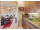 Butlers pantry with wood cabinetry and granite countertops at 14021 E Milton Ct, Scottsdale, AZ 85262
