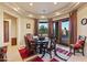 Elegant dining room with a round table and access to a patio at 14021 E Milton Ct, Scottsdale, AZ 85262