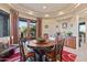 Formal dining room with a round table and access to the patio at 14021 E Milton Ct, Scottsdale, AZ 85262