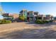 A luxury home with a large, paved driveway and desert landscaping at 14021 E Milton Ct, Scottsdale, AZ 85262