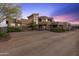 Luxury home with expansive driveway and desert landscape at 14021 E Milton Ct, Scottsdale, AZ 85262