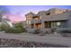 Modern Southwestern home with landscaping and a gated entrance at 14021 E Milton Ct, Scottsdale, AZ 85262