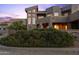 View of the front of a contemporary Southwestern home at sunset at 14021 E Milton Ct, Scottsdale, AZ 85262