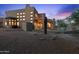 Luxury home exterior at dusk, showcasing architectural details at 14021 E Milton Ct, Scottsdale, AZ 85262