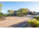 Luxury home with desert landscaping and a long driveway leading to the house at 14021 E Milton Ct, Scottsdale, AZ 85262