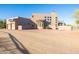 Luxury home with attached garage, stucco exterior, and desert landscaping at 14021 E Milton Ct, Scottsdale, AZ 85262