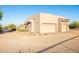 Two-car garage with desert landscaping at 14021 E Milton Ct, Scottsdale, AZ 85262