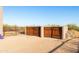 Rustic double gate leading to the property at 14021 E Milton Ct, Scottsdale, AZ 85262