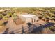 Aerial view of horse stables with gated enclosure at 14021 E Milton Ct, Scottsdale, AZ 85262