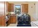 Laundry room with washer, dryer, and ample cabinetry at 14021 E Milton Ct, Scottsdale, AZ 85262