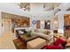Bright living room with high ceilings, comfortable seating, and a view of the kitchen at 14021 E Milton Ct, Scottsdale, AZ 85262