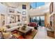 Open living space with high ceilings, stone fireplace, and lots of natural light at 14021 E Milton Ct, Scottsdale, AZ 85262