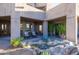 Covered patio with seating area and desert landscaping at 14021 E Milton Ct, Scottsdale, AZ 85262
