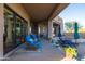 Covered patio with pool access and wicker furniture at 14021 E Milton Ct, Scottsdale, AZ 85262