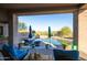 Inviting pool area with lounge chairs and covered patio at 14021 E Milton Ct, Scottsdale, AZ 85262