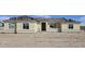 Under-construction single-story stucco home featuring a Spanish tile roof, and white-framed windows at 1928 W Big Sky Ln, Queen Creek, AZ 85144