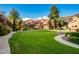 Complex with lush green courtyard and walkways at 14203 N 19Th Ave # 1055, Phoenix, AZ 85023