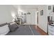 King-size bed in a well-lit bedroom with bathroom access at 14203 N 19Th Ave # 1055, Phoenix, AZ 85023