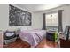 Bright bedroom with double bed and hardwood floors at 14203 N 19Th Ave # 1055, Phoenix, AZ 85023