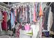 Large walk-in closet with ample hanging space and shelving at 14203 N 19Th Ave # 1055, Phoenix, AZ 85023