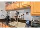 Modern kitchen with granite countertops and a pass-through to living area at 14203 N 19Th Ave # 1055, Phoenix, AZ 85023