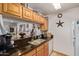 Kitchen boasts granite countertops, ample cabinetry, and a breakfast bar at 14203 N 19Th Ave # 1055, Phoenix, AZ 85023