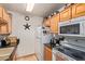 Well-equipped kitchen featuring granite countertops and modern appliances at 14203 N 19Th Ave # 1055, Phoenix, AZ 85023