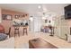 Open living area with a view into the kitchen and breakfast bar at 14203 N 19Th Ave # 1055, Phoenix, AZ 85023