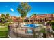Community pool with surrounding patio and seating at 14203 N 19Th Ave # 1055, Phoenix, AZ 85023