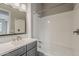 Bright bathroom features a shower-tub combo and a grey vanity at 578 E Las Puertas Ln, Queen Creek, AZ 85140