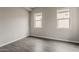 Bedroom with two windows provides natural light and comfortable space at 578 E Las Puertas Ln, Queen Creek, AZ 85140